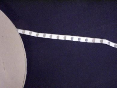 Domes Placed on Linear Tape & Die Cut to Spec 